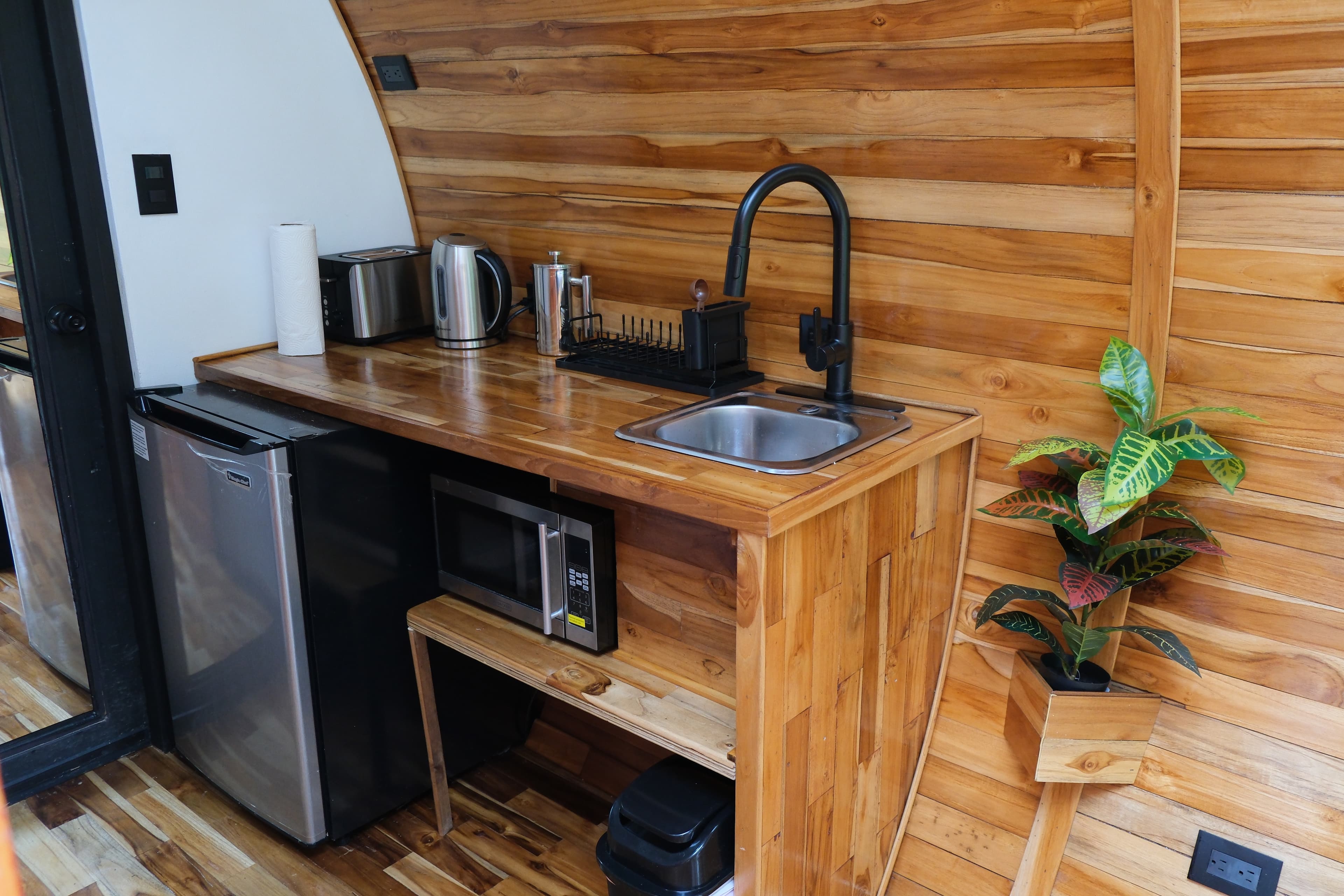 A casita's kitchenette: sink, fridge, microwave