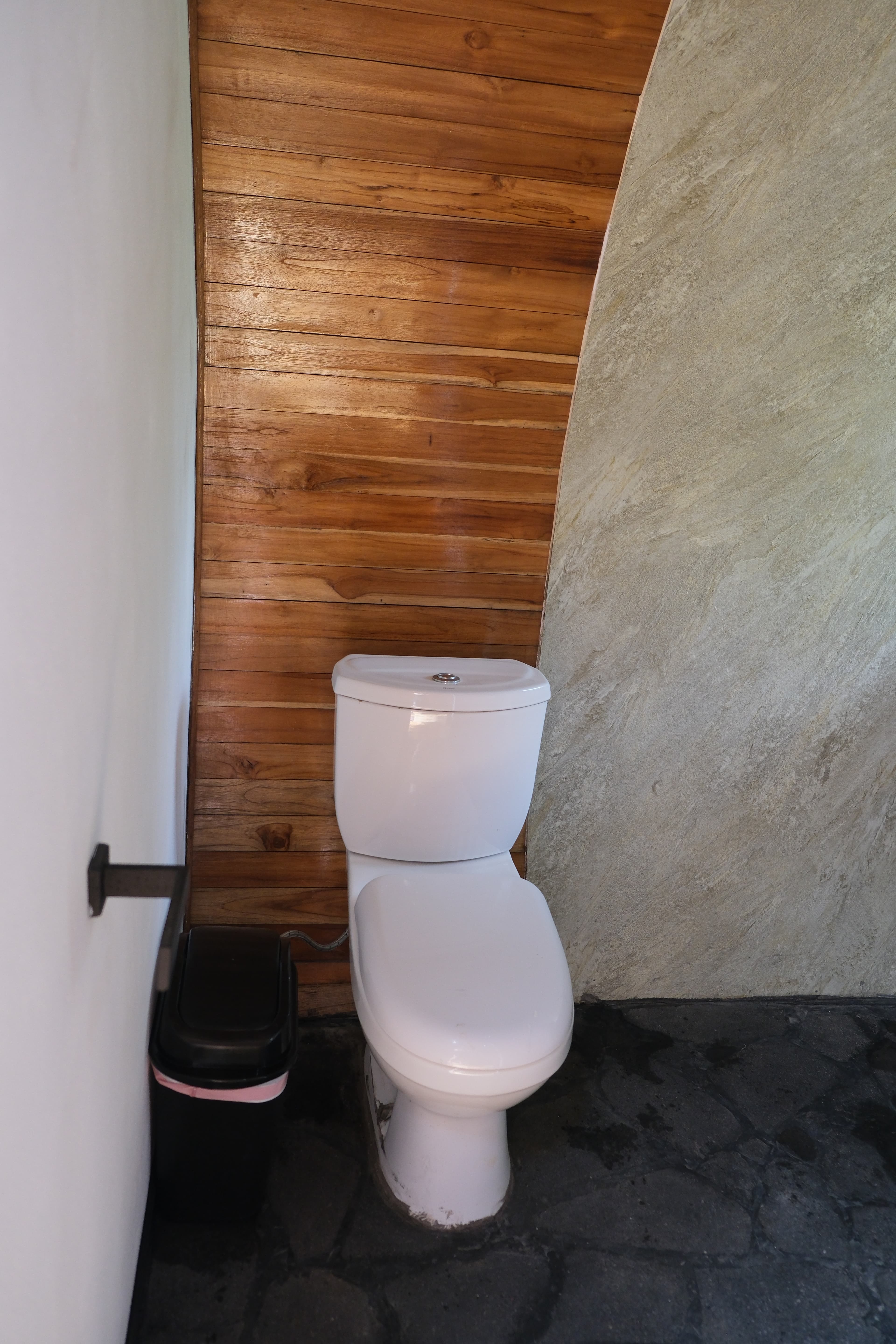 A casita's bathroom under the curved wooden wall