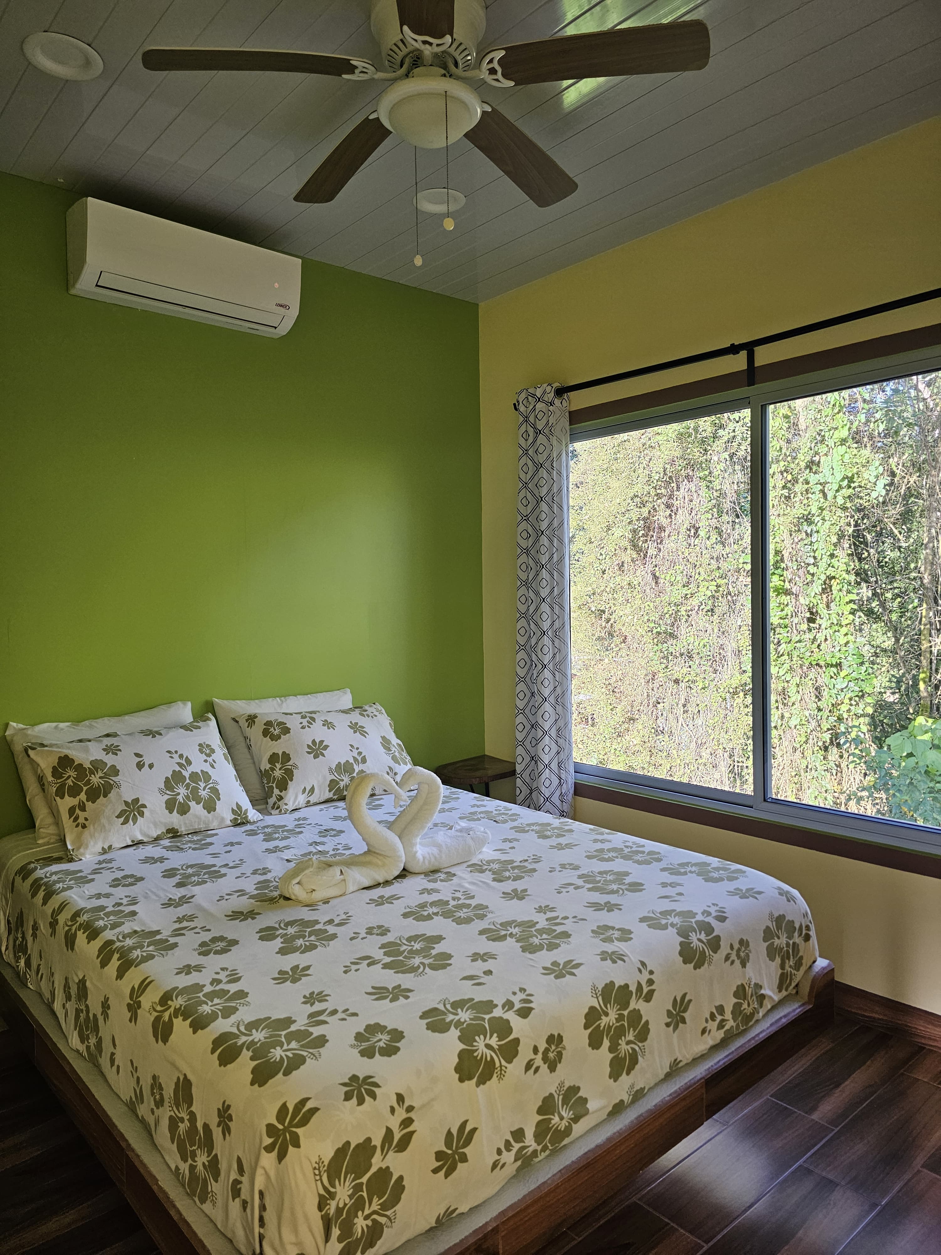 Bedroom 1, queen bed, green walls